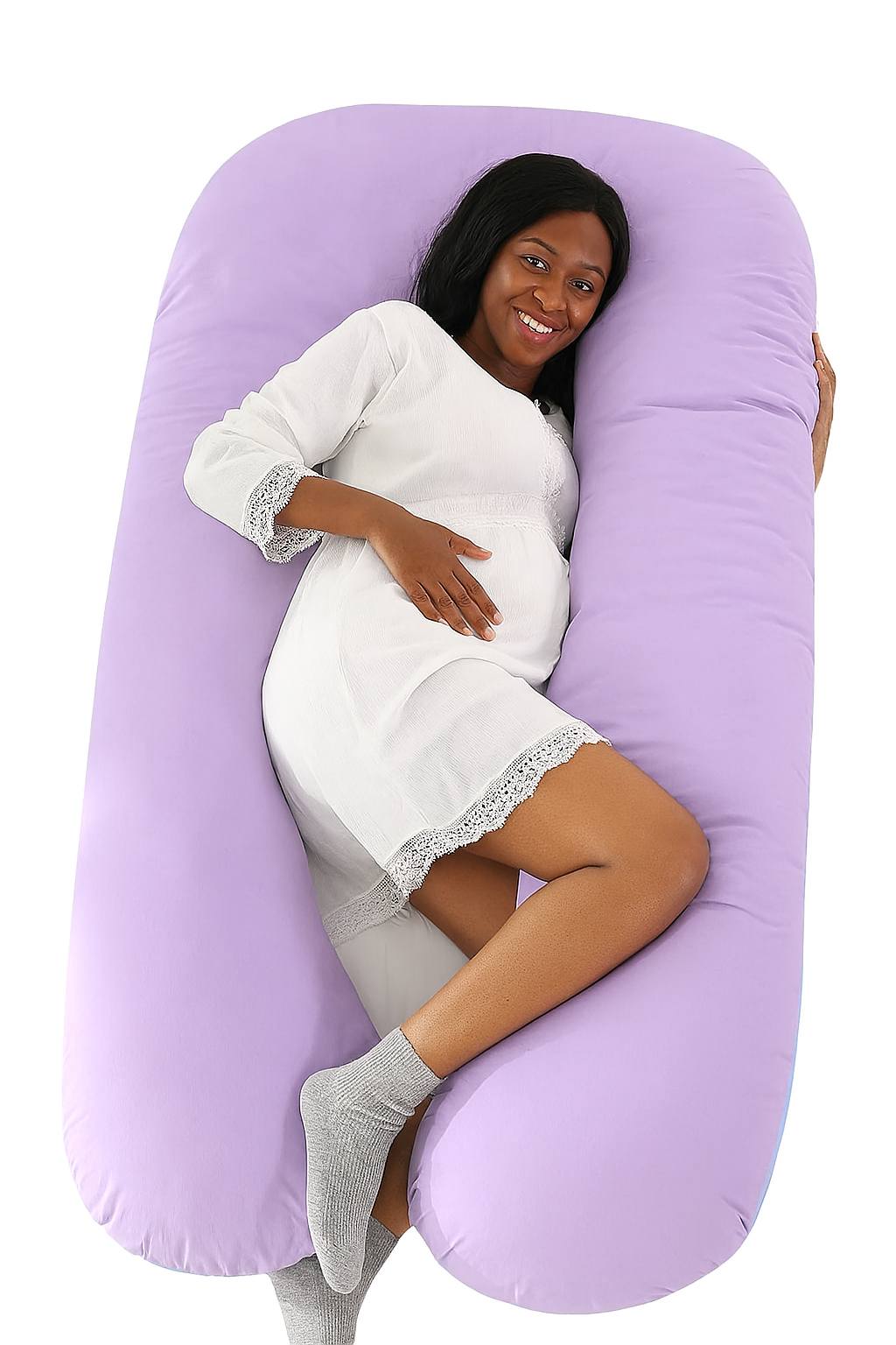 Woman lying on a large purple U-shaped body pillow.