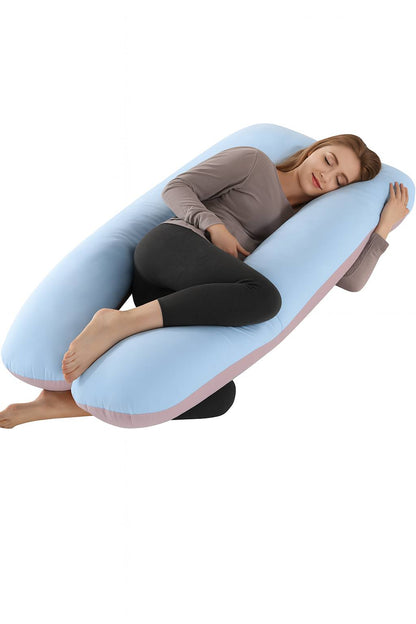 Woman lying on a U-shaped body pillow with a white background