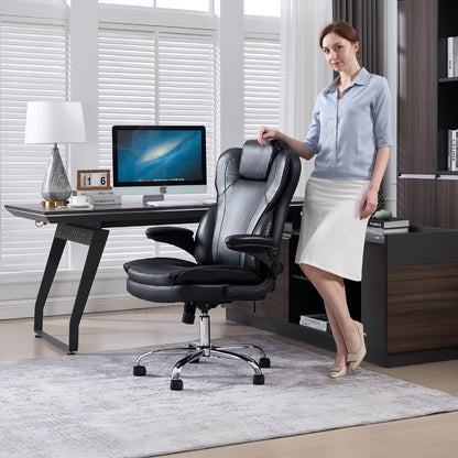 Woman standing beside the executive chair with the armrests flipped up