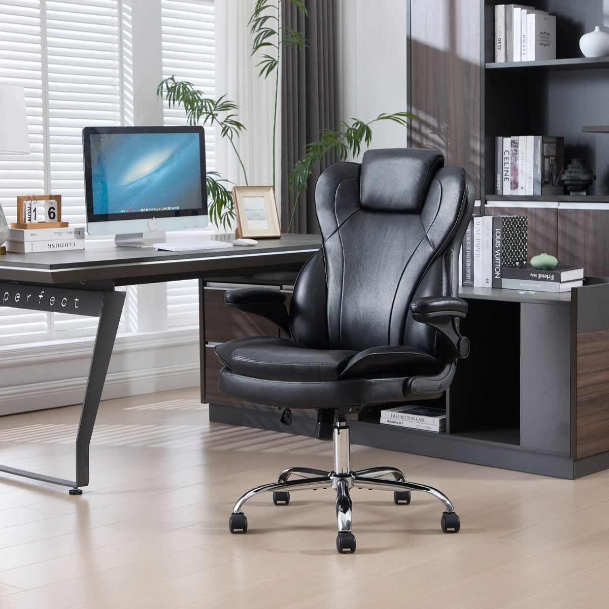 Black leather executive chair at a home office desk