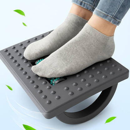 Person using a foot exercise device with a light blue background
